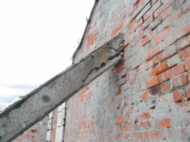 A concrete buttress supporting the terra cotta wall is crumbling and the steel beam inside severely rusted
